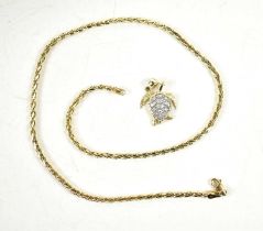 A 14ct gold and diamond set sea turtle pendant, the shell set with nineteen diamond brilliants, on a