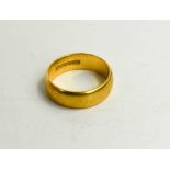 A 22ct gold wedding band, size J/K, 6.13g.