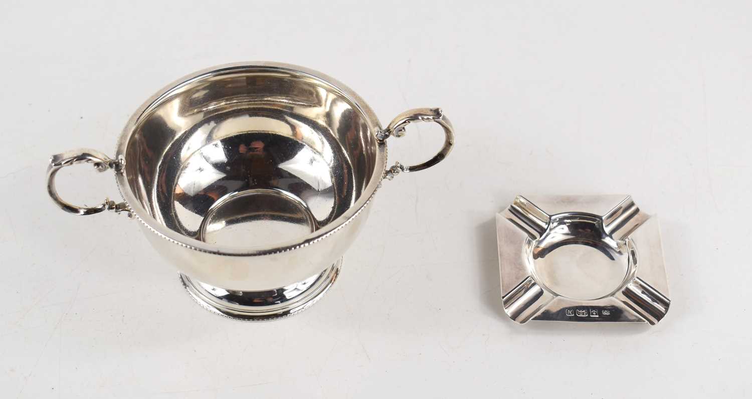 A silver twin handled pedestal bowl together with a small silver ashtray, both hallmarked for - Image 2 of 2