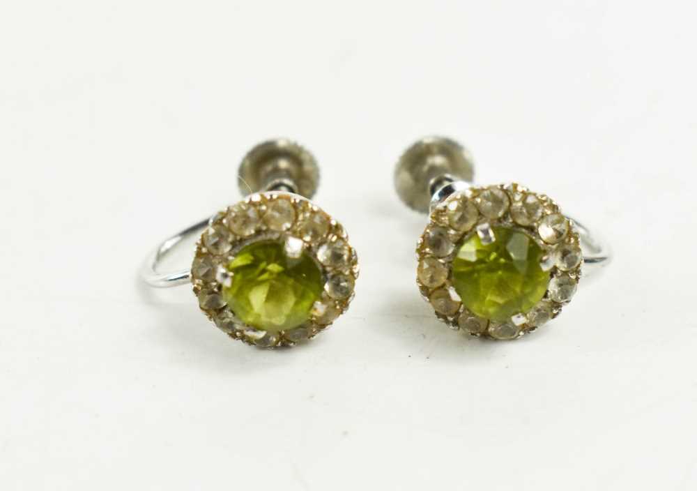 A pair of 9ct white gold and lime green stone, and white paste border, 2.85g.
