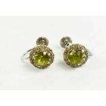 A pair of 9ct white gold and lime green stone, and white paste border, 2.85g.