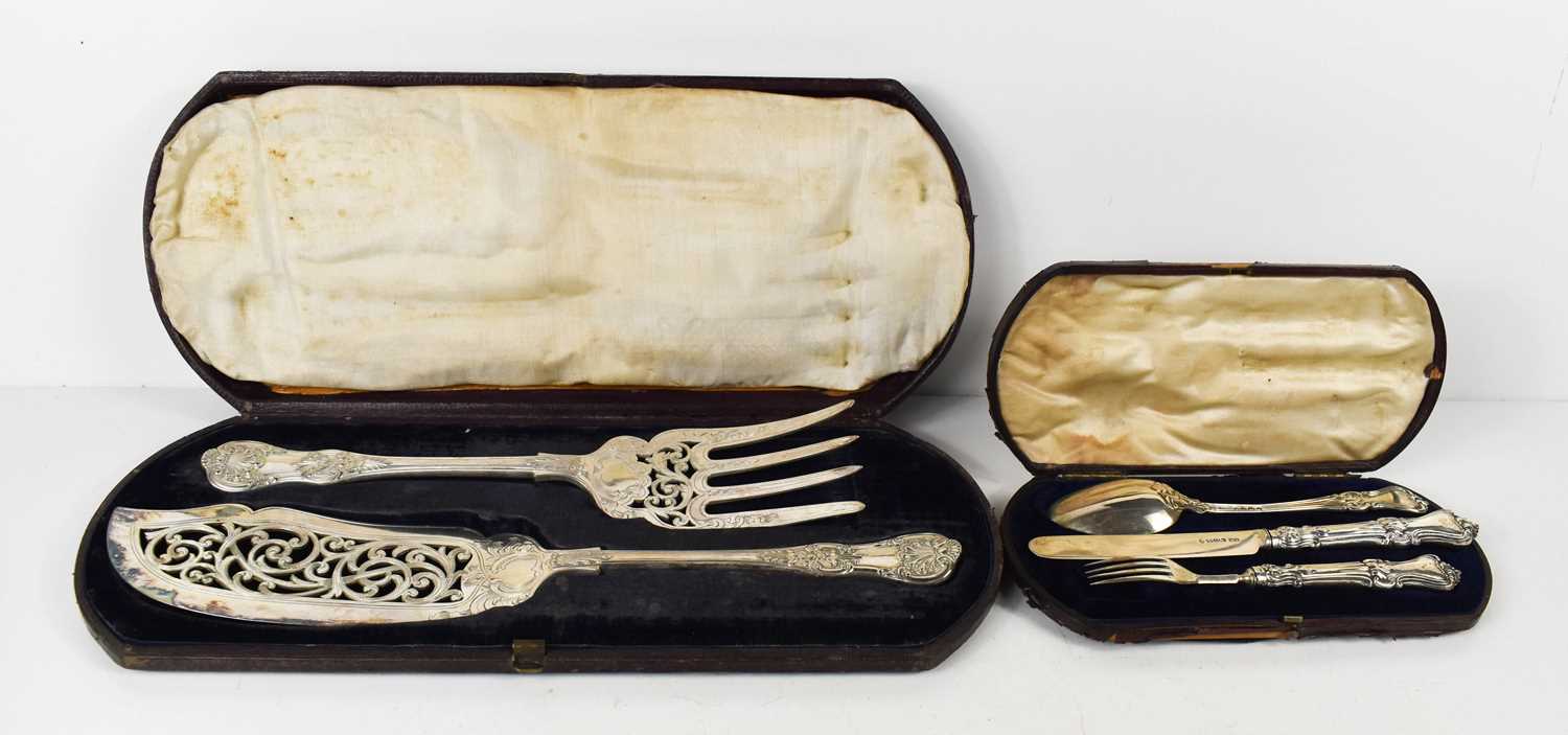 A silver knife, fork and spoon set, the solid silver fork and knife with silver clad handles, in the