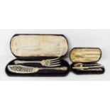 A silver knife, fork and spoon set, the solid silver fork and knife with silver clad handles, in the