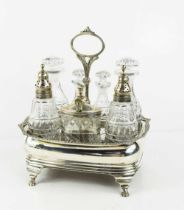 A fine silver cruet set, the shaped rectangular base having a central hoop form handle, housing