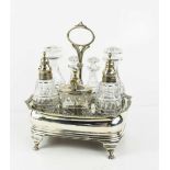 A fine silver cruet set, the shaped rectangular base having a central hoop form handle, housing