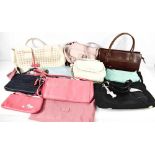 A collection of seven Radley handbags, together with a leather Tula bag and a Yoshi bag.