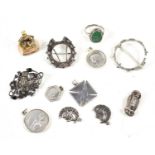 A group of silver jewellery to include a silver and marcasite frog form brooch, owl brooch,