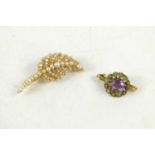 An amethyst and turquoise brooch, unmarked and not testing as gold, 2.75g, 27 by 15mm, the oval