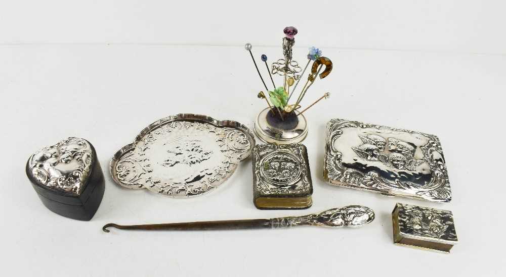 A group of Victorian style silver, including a card case with watered silk lining, dressing table