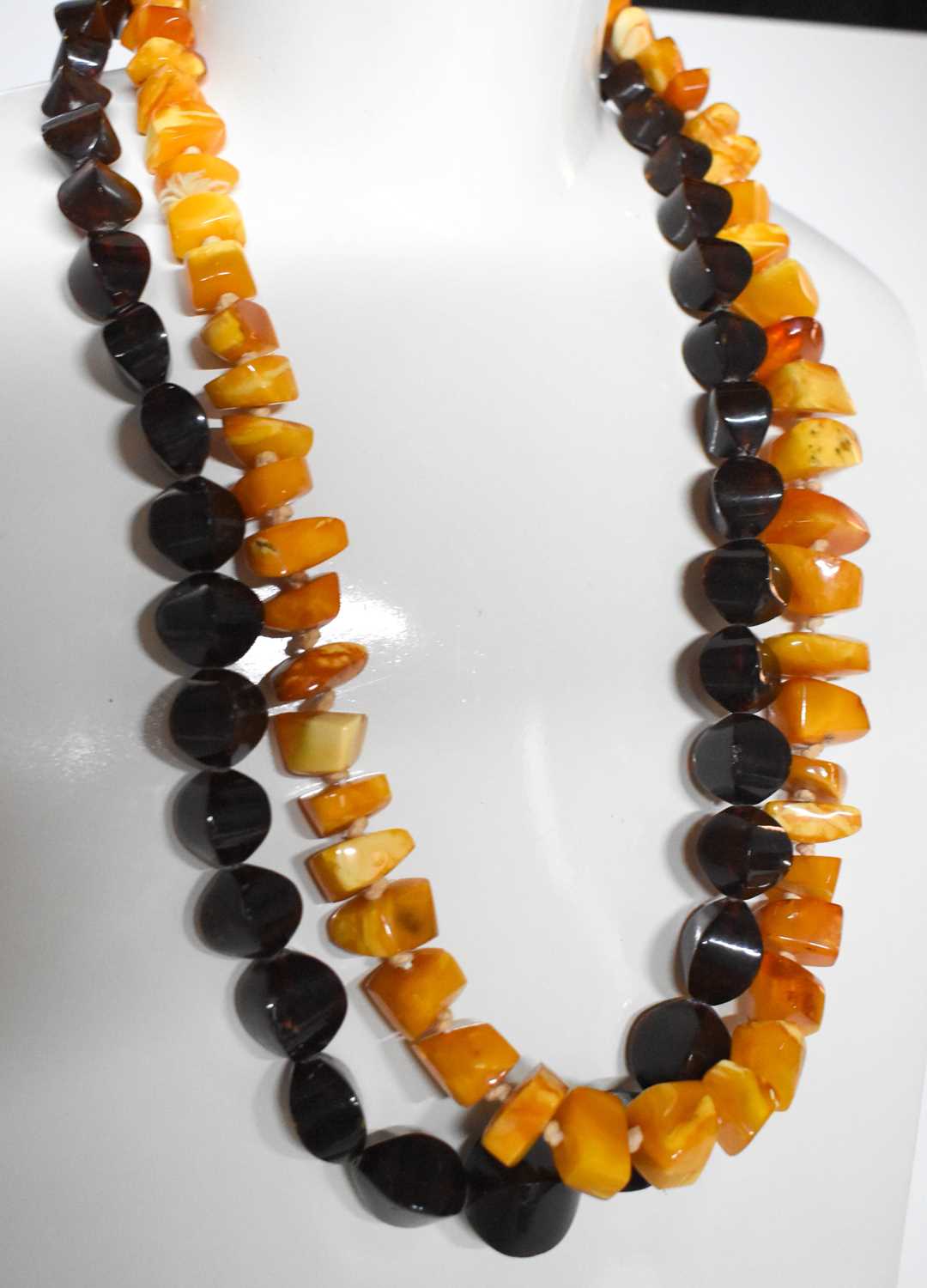 A string of vintage butterscotch amber beads, of polished angular form, 81.1g, together with a - Image 2 of 2