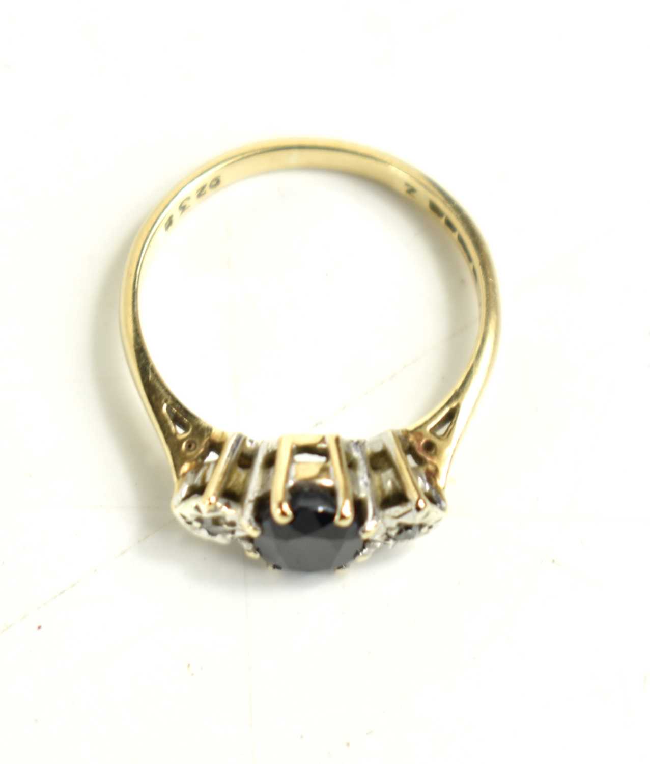 A 9ct gold, sapphire and diamond ring, the central oval cut sapphire of approximately 6.8 by 5.5mm - Image 2 of 2