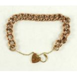 A 9ct gold curb link charm bracelet, with heart shaped padlock clasp, 16.8g, 19cm long.
