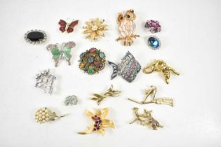 A group of vintage and later broches, including a Scottish white metal pendant brooch with