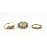 A 9ct gold and diamond ring, with seven heart shaped settings in continuous form, each set with a