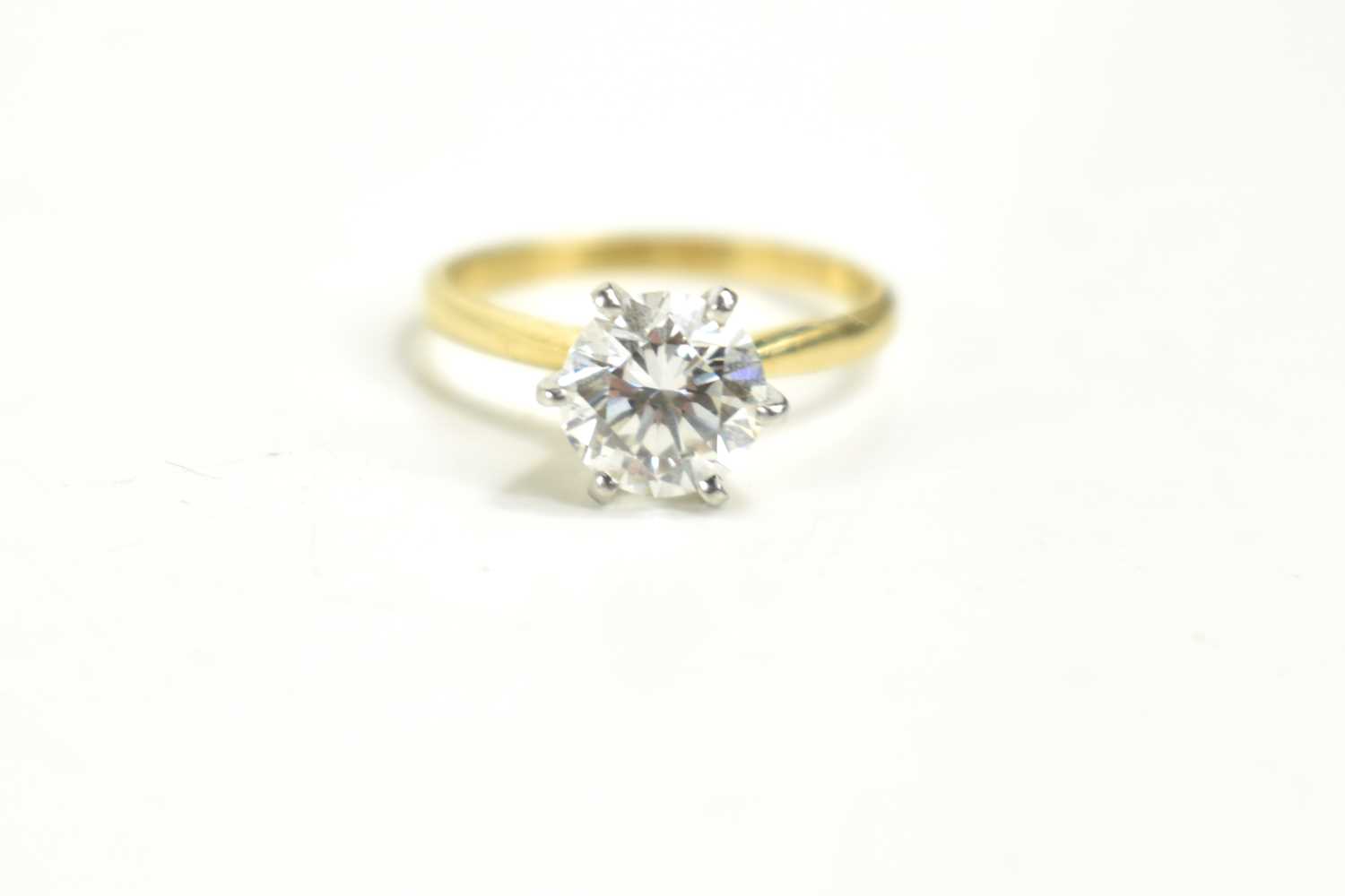 An 18ct gold, platinum and diamond solitaire ring, the diamond of approximately 1.5ct, 7.3mm - Image 2 of 2