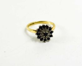 An 18ct gold cluster ring, set with small dark and white stones, size P, 4.5g.