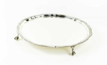 An early 20th century silver salver by Goldsmiths & Silversmiths Company, with a gadrooned