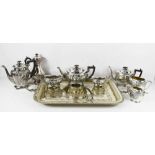 A group of silver plate comprising a tray with Masonic inscription, two tea sets and an additional