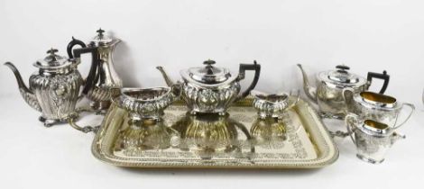 A group of silver plate comprising a tray with Masonic inscription, two tea sets and an additional