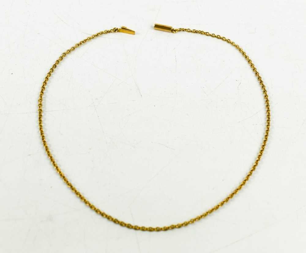 A 15ct gold chain link necklace, with barrel form clasp, 31cm long, 3.23g.