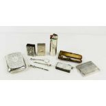 A group of silver smokers accessories including two vintage cigarette holders, two match box