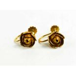 A pair of 9ct gold flower head form earrings, with screw on backs, 3.69g.