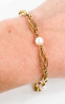 A 9ct gold and pearl bracelet, composed of spiral links interspersed with pearls, with hoop clasp