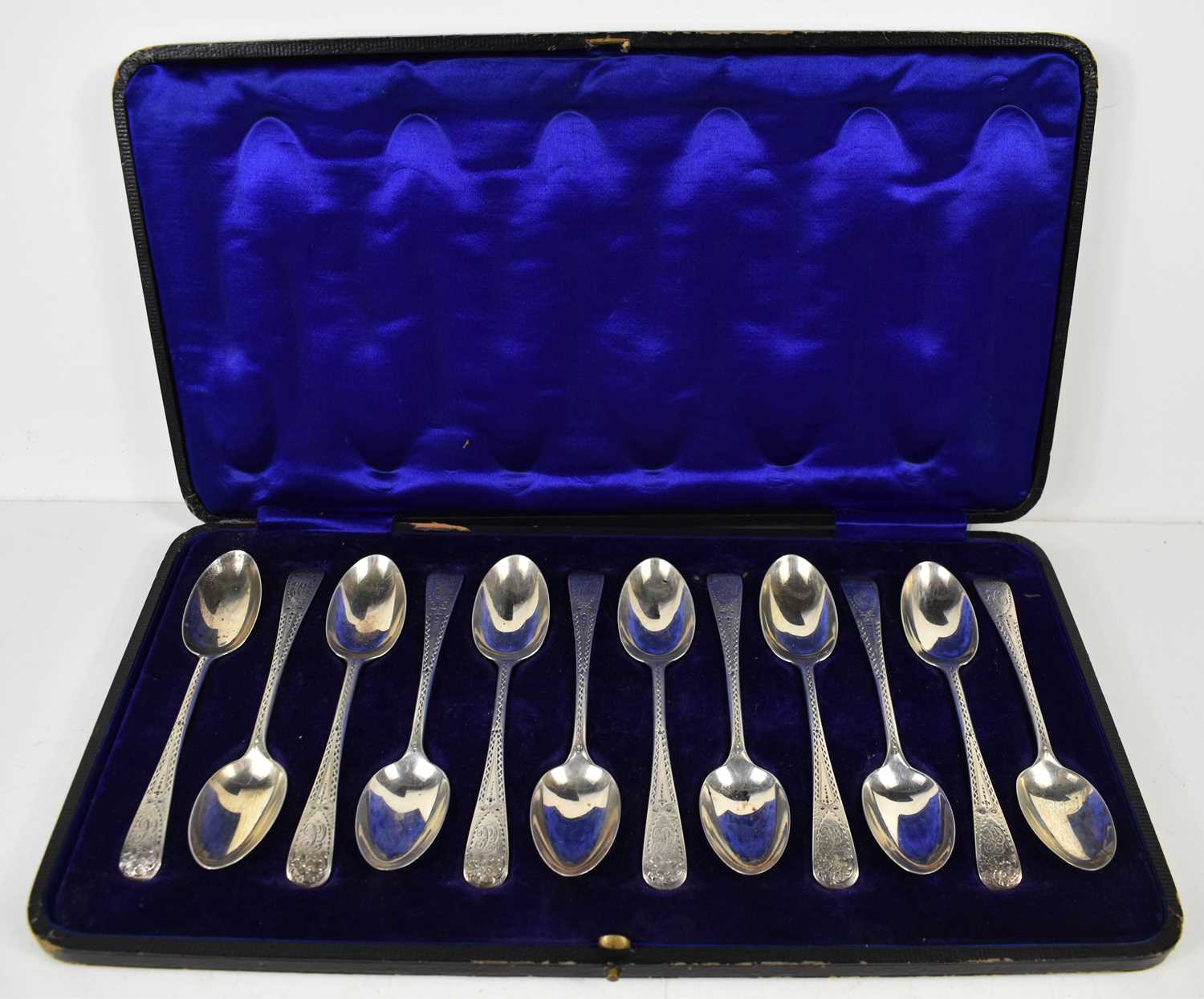 A set of twelve silver teaspoons, London 1901, engraved with decoration to the handles and
