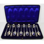 A set of twelve silver teaspoons, London 1901, engraved with decoration to the handles and
