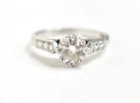 A platinum and diamond solitaire ring, the central stone of approximately 6.2mm diameter, 0.9ct,