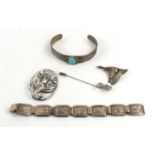 A group of silver to include a Danish style flower brooch, white metal and turquoise bangle, a goose