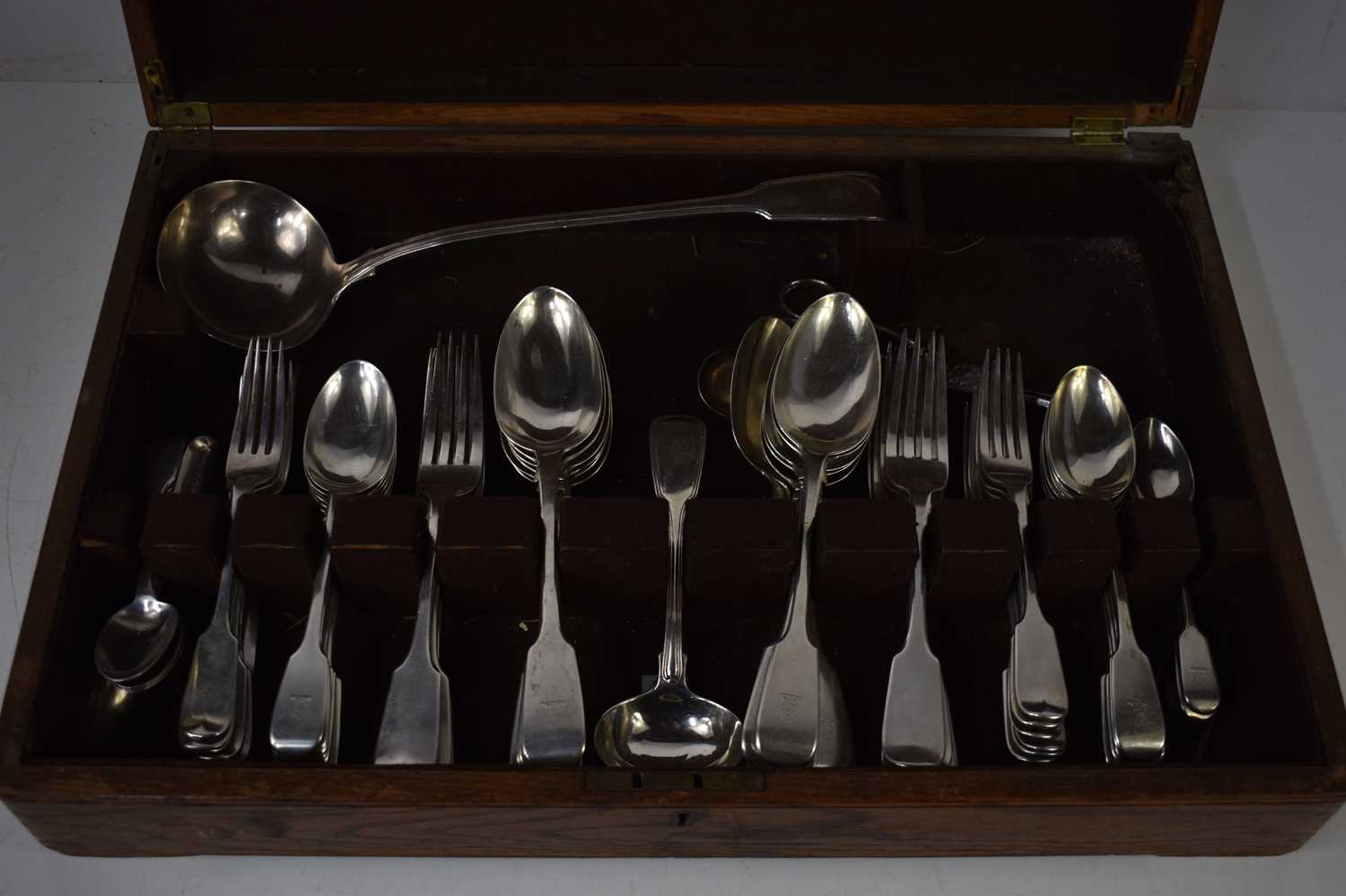 An oak cased canteen of silver cutlery comprising a large silver ladle engraved with arm holding - Image 2 of 2