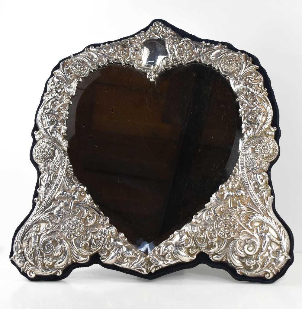 A fine & impressive silver heart form mirror, Sheffield 1995, the silver border embossed profusely - Image 2 of 5