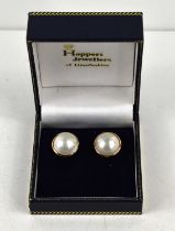A pair of blister or half pearl earrings, likely set in 18ct gold, with 18ct gold butterflies, 8.