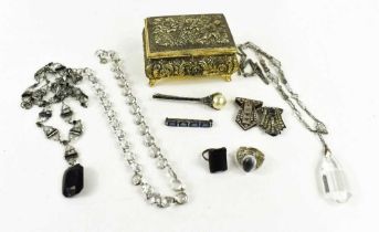 A group of Art Deco and later costume jewellery comprising a cut glass pendant necklace, a jet and