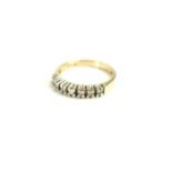 A 9ct gold and diamond seven stone ring, size Q, 3.2g.