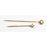 A gold (testing as at least 14ct), diamond and pearl hat pin, of flower head form, set with old