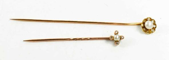 A gold (testing as at least 14ct), diamond and pearl hat pin, of flower head form, set with old