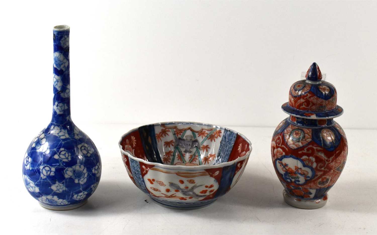 A small Imari bowl, of fluted form, the inside with underglazed blue and white central panel