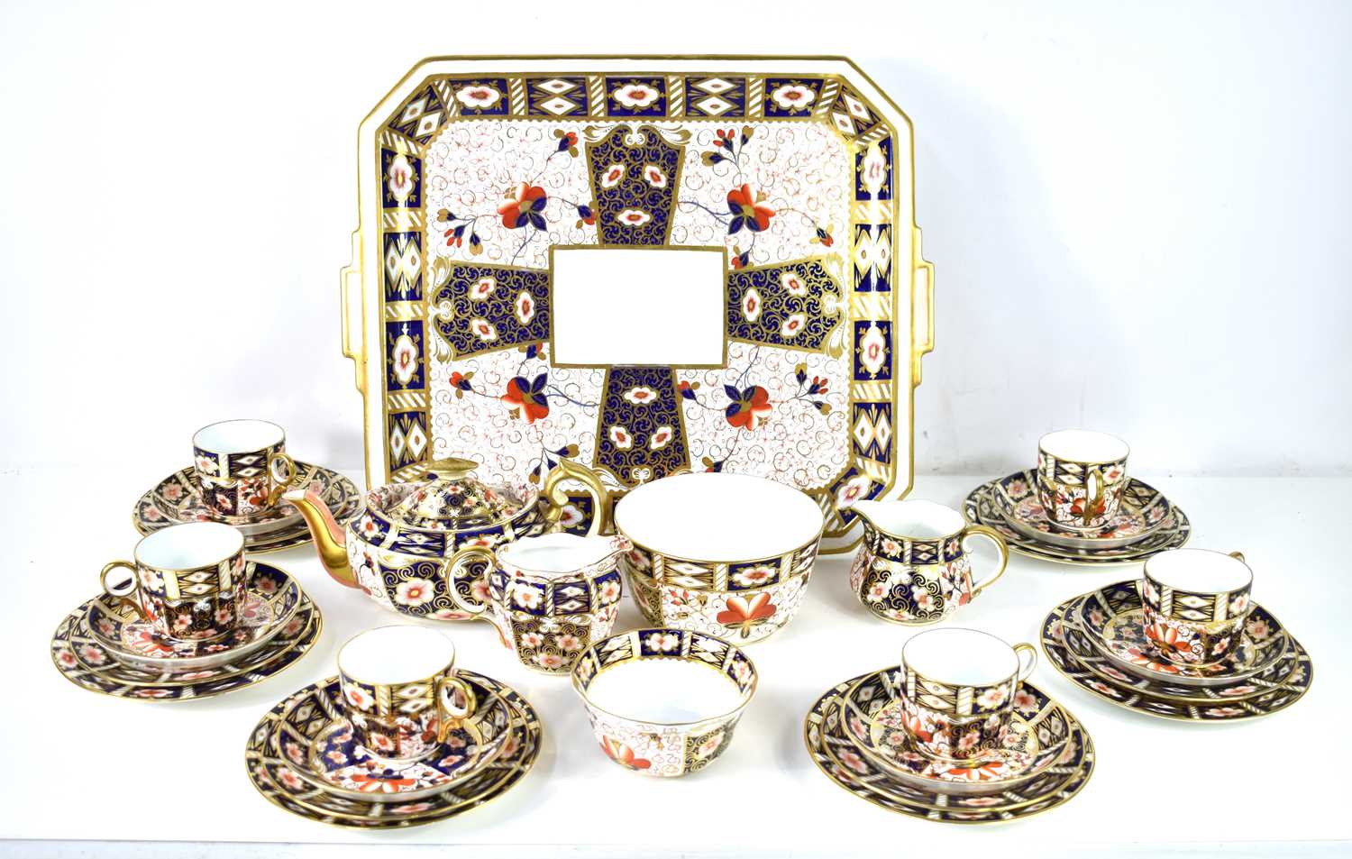 A Royal Crown Derby Imari part tea service in the 2451 pattern, decorated with lotus blossom and