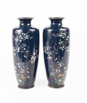 A pair of Art Deco cloisonne vases, of baluster form, the dark blue ground decorated with birds,