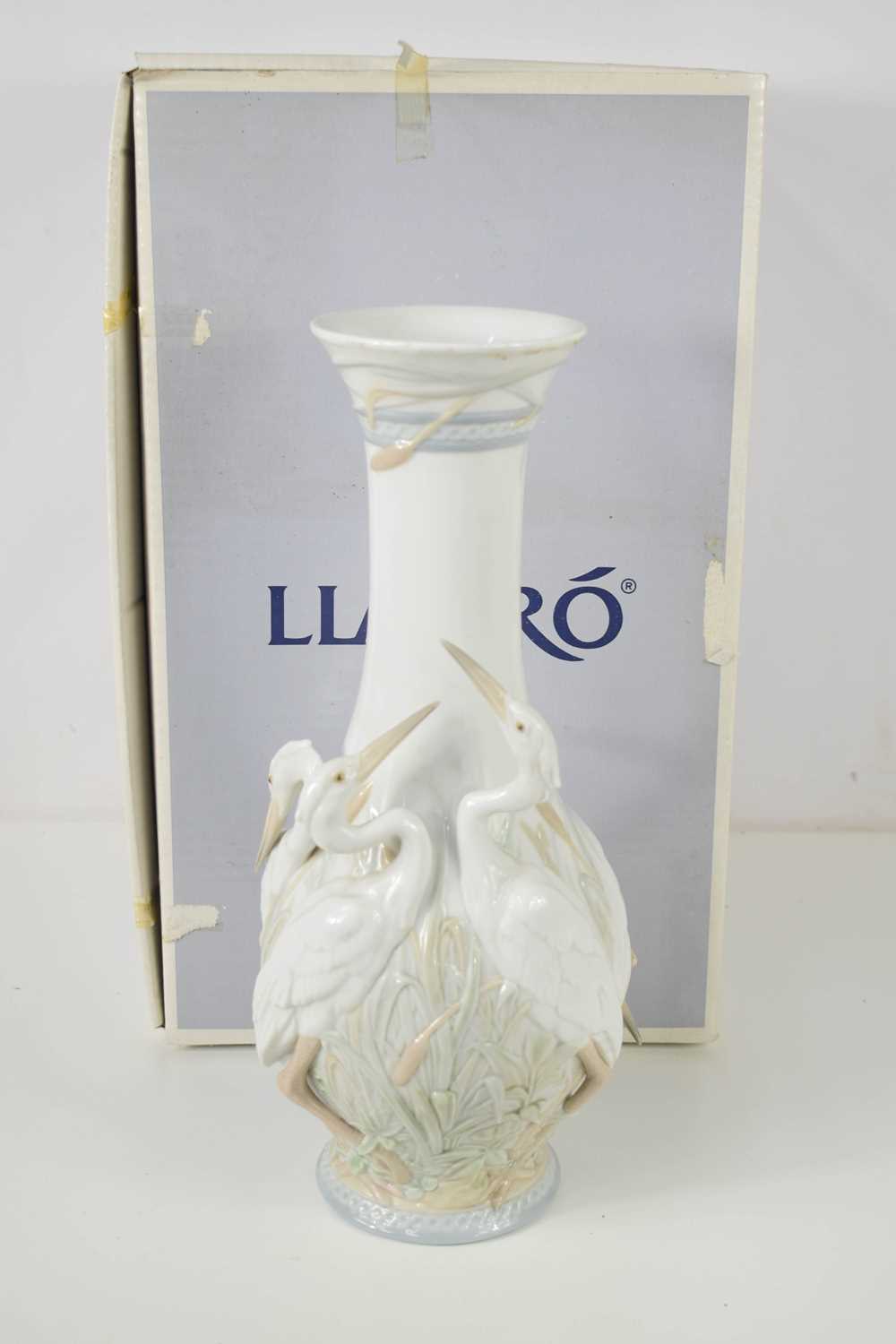 A Lladro vase modelled with three herons to the body, titled Herons Realm, with the original box,