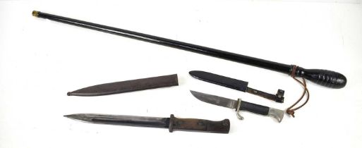 An Imperial German bayonet and scabbard, the blade marked Carl Eickhorn together with a small