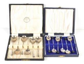 A cased set of six silver teaspoons, hallmarked for London 1925, together with a set of six silver