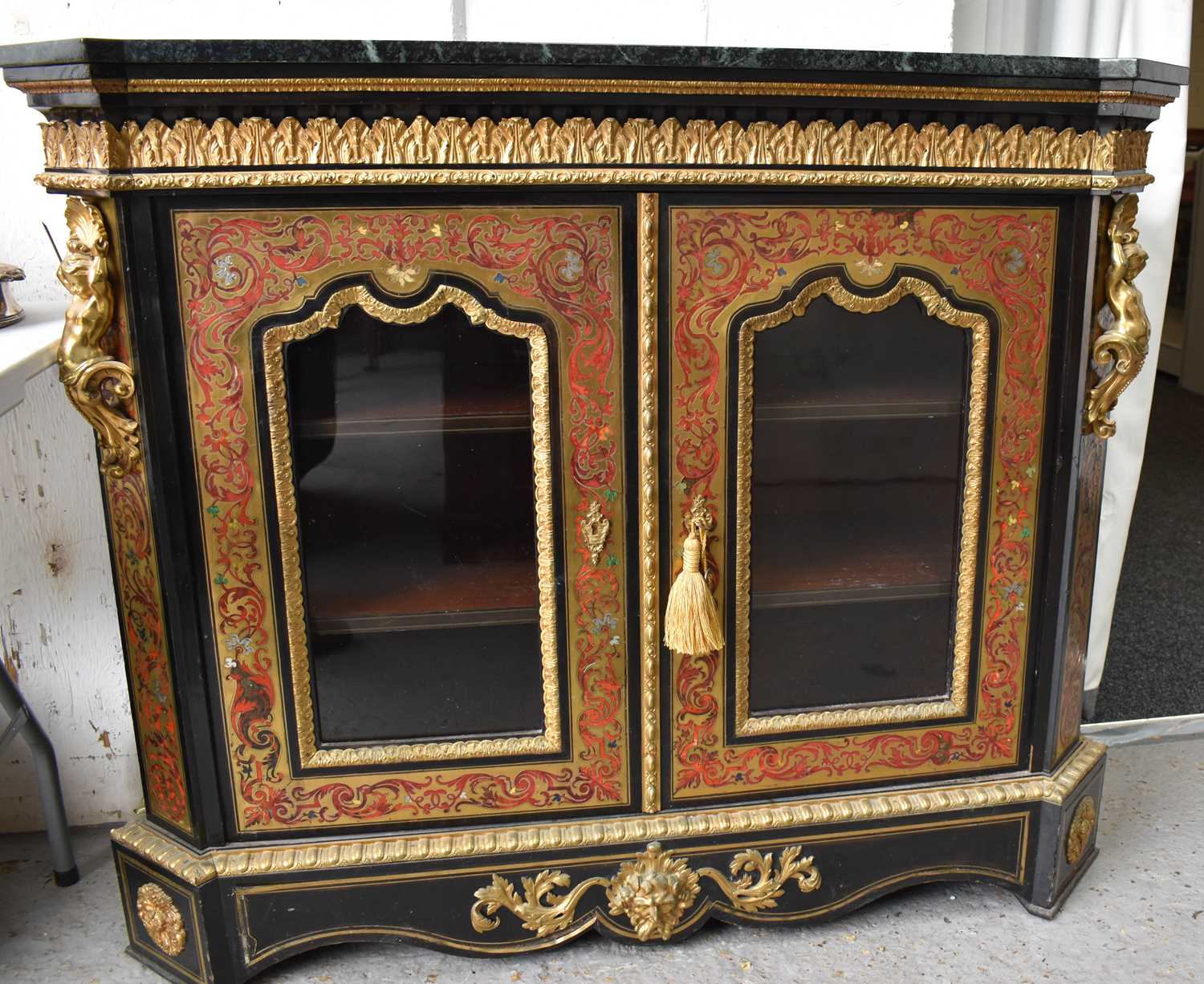 A 19th century style French boulework cabinet, having shaped serpentine marble top, to ebony cabinet