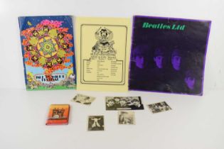 A 1970 Isle of Wright festival programme and advertising flyer together with a Beatles Ltd book,