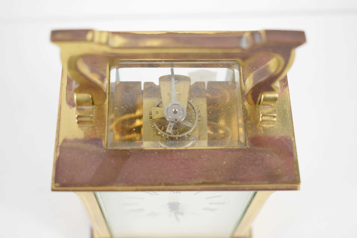 A brass cased carriage clock retailed by A Fattorini, Harrogate, 11.5cm high. - Image 2 of 2