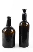 A 19th century Emanuel College glass bottle, circa 1830, together with an antique glass bottle A/F.