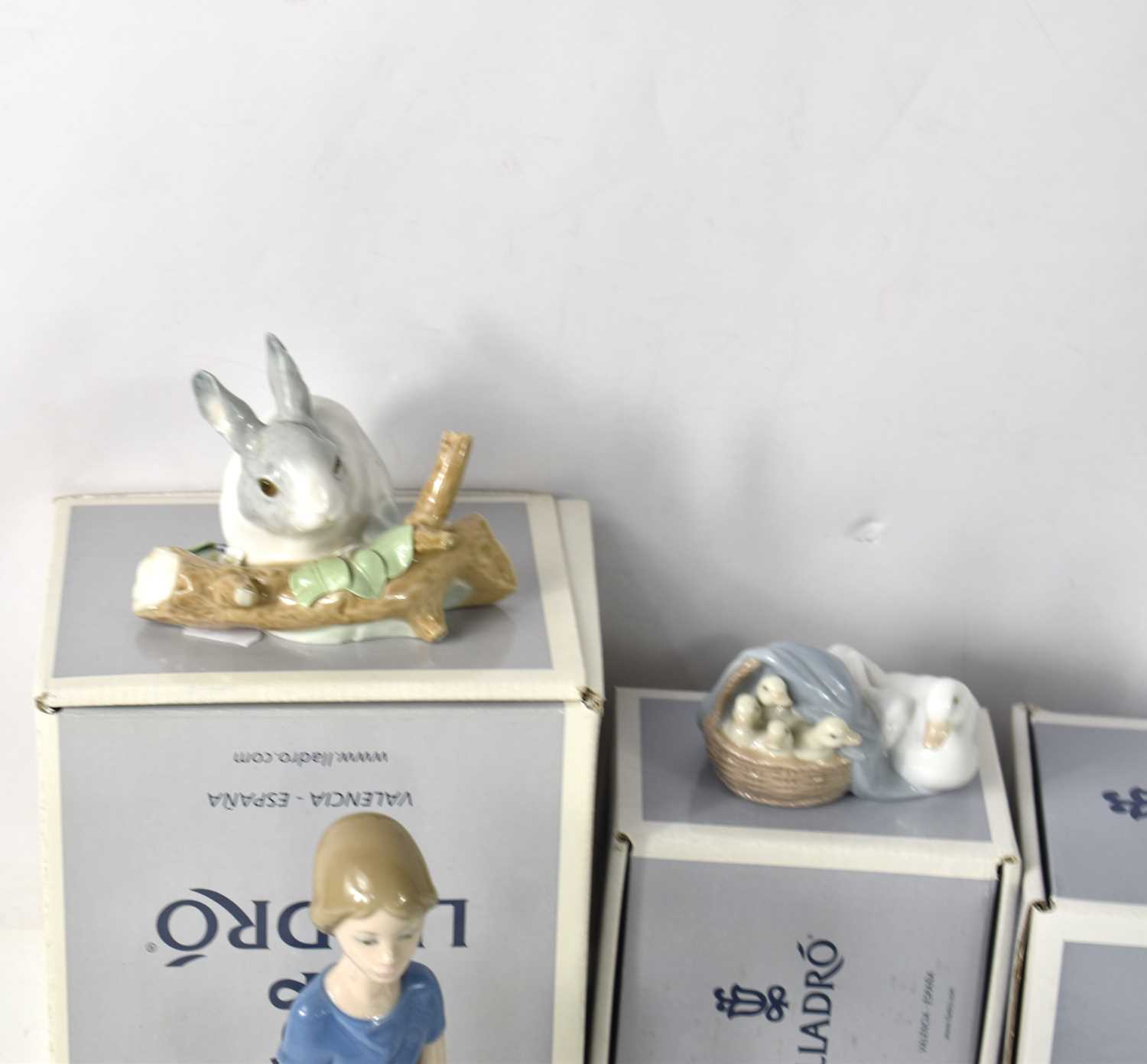 A group of Lladro porcelain, to include Pastorcito con Pajaro, Nina Con Paraguas Y Patos, Oca - Image 2 of 4