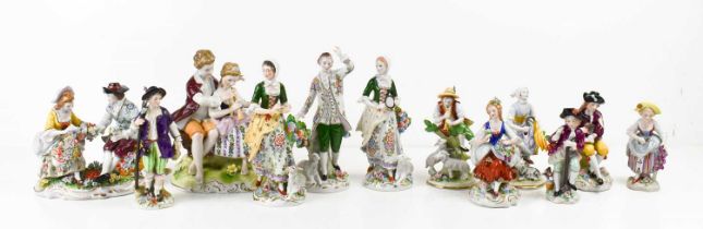A selection of German porcelain figurines, predominantly Sitzendorf examples including a pair of